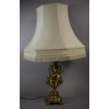 A Large Modern Polished Brass Figural Table Lamp in the Form of Cherub Before Two Handled Vase,