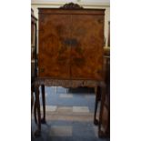 A Mid 20th Century Burr Walnut Cocktail Cabinet on Carved Support and Cabriole Legs Culminating in