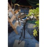 A Wrought Iron Circular Topped Plant Stand on Tripod Support, 36.5cm DIameter