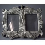 A Reproduction Silver Plate Double Photo Frame Decorated in Relief with Angel and Cherubs, Swags