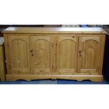 A Stripped Pine Sideboard with Four Panelled Doors, 165cm long