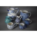 A Collection of Six Various Blue and White Transfer Printed Jugs