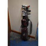 A Collection of Various Vintage Golf Clubs and Bag