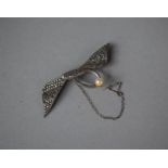 A Silver, Pearl and Marcasite Brooch (missing Two Marcasites) In the Form of a Winged Serpent