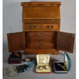 A Novelty Jewellery Case in the Form of a Fall Front Bureau Containing Some Costume Jewellery, 25.