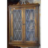 A Wood Brothers Oak Wall Hanging Corner Cabinet with Leaded Glazed Doors, 69cm Wide