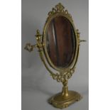 A Reproduction Oval Brass Framed Swing Mirror, 39cm High