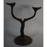 An Unusual Cast Iron Two Branch Candelabra, 39.5cm High