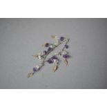 A Silver Bracelet with Amethyst and Quartz Chips and Stylised Feather Decoration