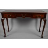 A Reproduction Three Drawer Mahogany Side Table on Cabriole Supports, 122cm Wide
