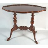 A Reproduction Mahogany Oval Piecrust Topped Occasional Table with Twin Turned Supports, 55cm Wide