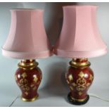 A Pair of Red and Gilt Baluster Vase Table Lamps with Pink Shades