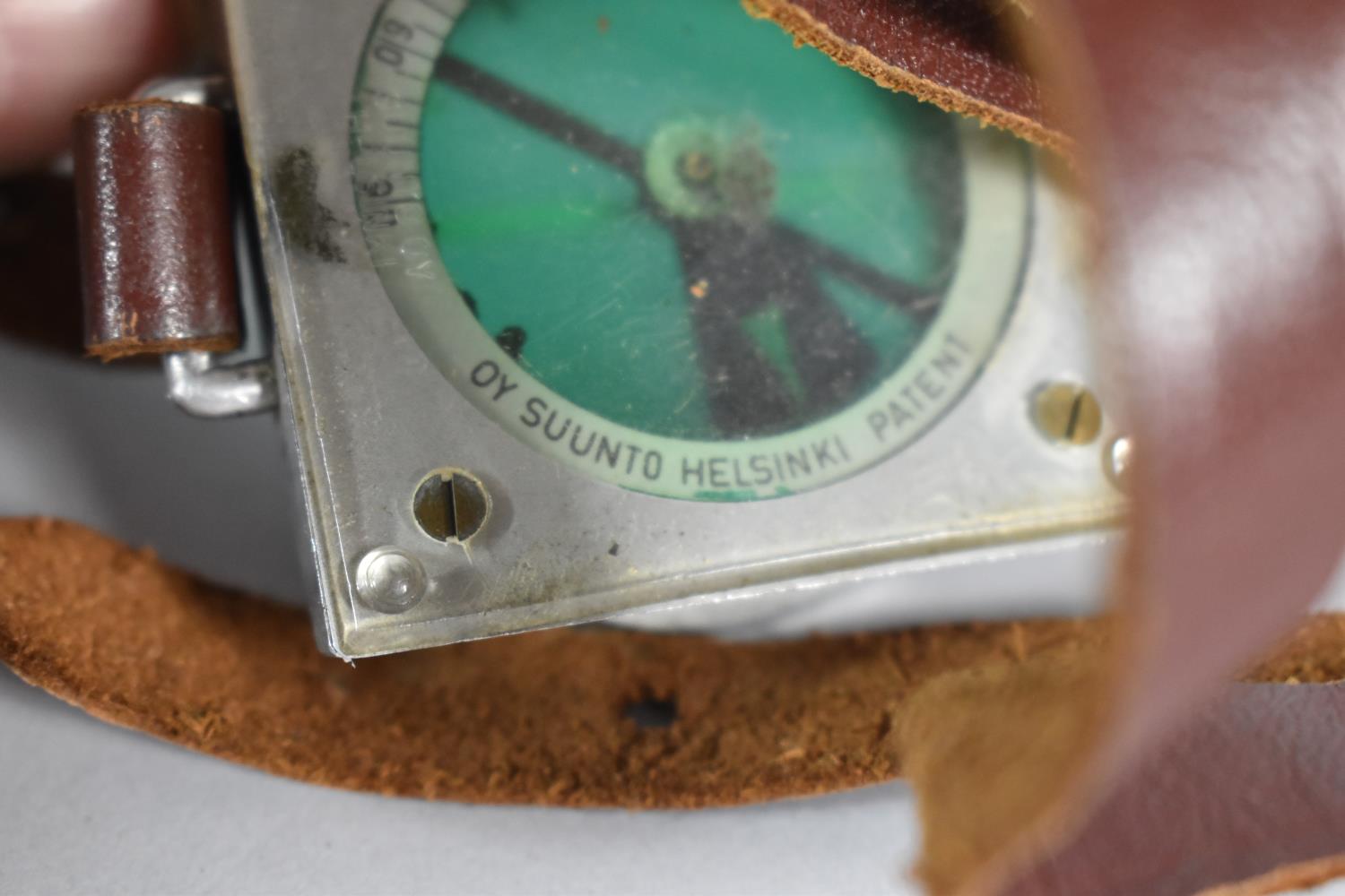 A Finnish Military Pilot's Compass with Wrist Strap, Stamped Suunto Oy, Helsinki - Image 2 of 3