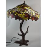 A Reproduction Cast Metal Based Tiffany Style Table Lamp, The Support in the The form of a Tree