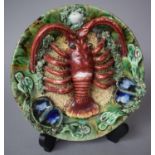 A Portuguese Palissy Style Dish Decorated with Lobster and Mussel Shells in Relief, 21cm Diameter