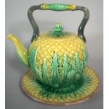 A 19th Century Majolica Teapot and Stand Modelled in the Form of a Pineapple, 17cm high (Hairline to