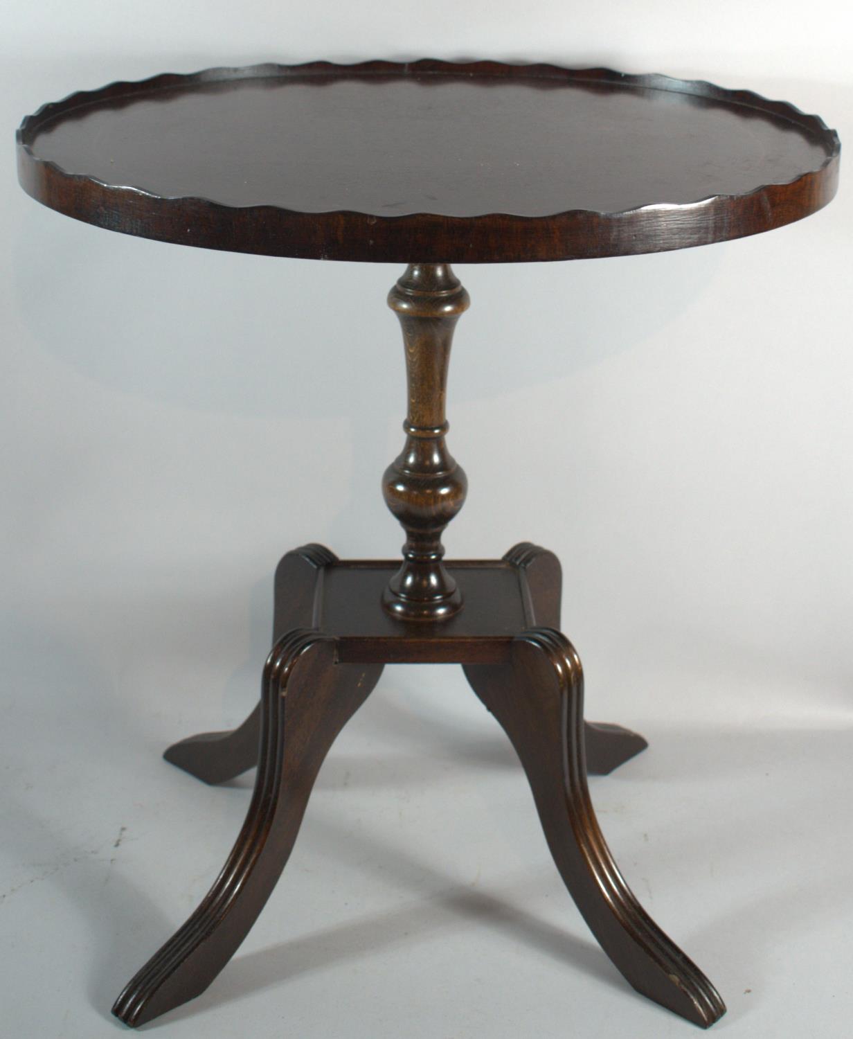 A Reproduction Mahogany Oval Topped Occasional Table with Galleried Top, 47.5cms Wide