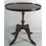 A Reproduction Mahogany Oval Topped Occasional Table with Galleried Top, 47.5cms Wide