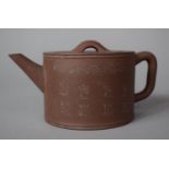 A Yixing (Purple CLay) Teapot decorated with Character Marks and Scrolls, Seal Marks to Base, 7.5cms