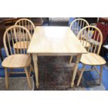 A Modern Rectangular Kitchen Table, 121cm x 77cm Together with four Hoop Spindle Back Chairs