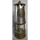 A Steel and Brass Miners Safety Lamp by Type 1A by the Protector Lamp and Lighting Company