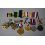 A Collection of Military items to Include Medals, Badges, Ribbons, Coronation Medallions