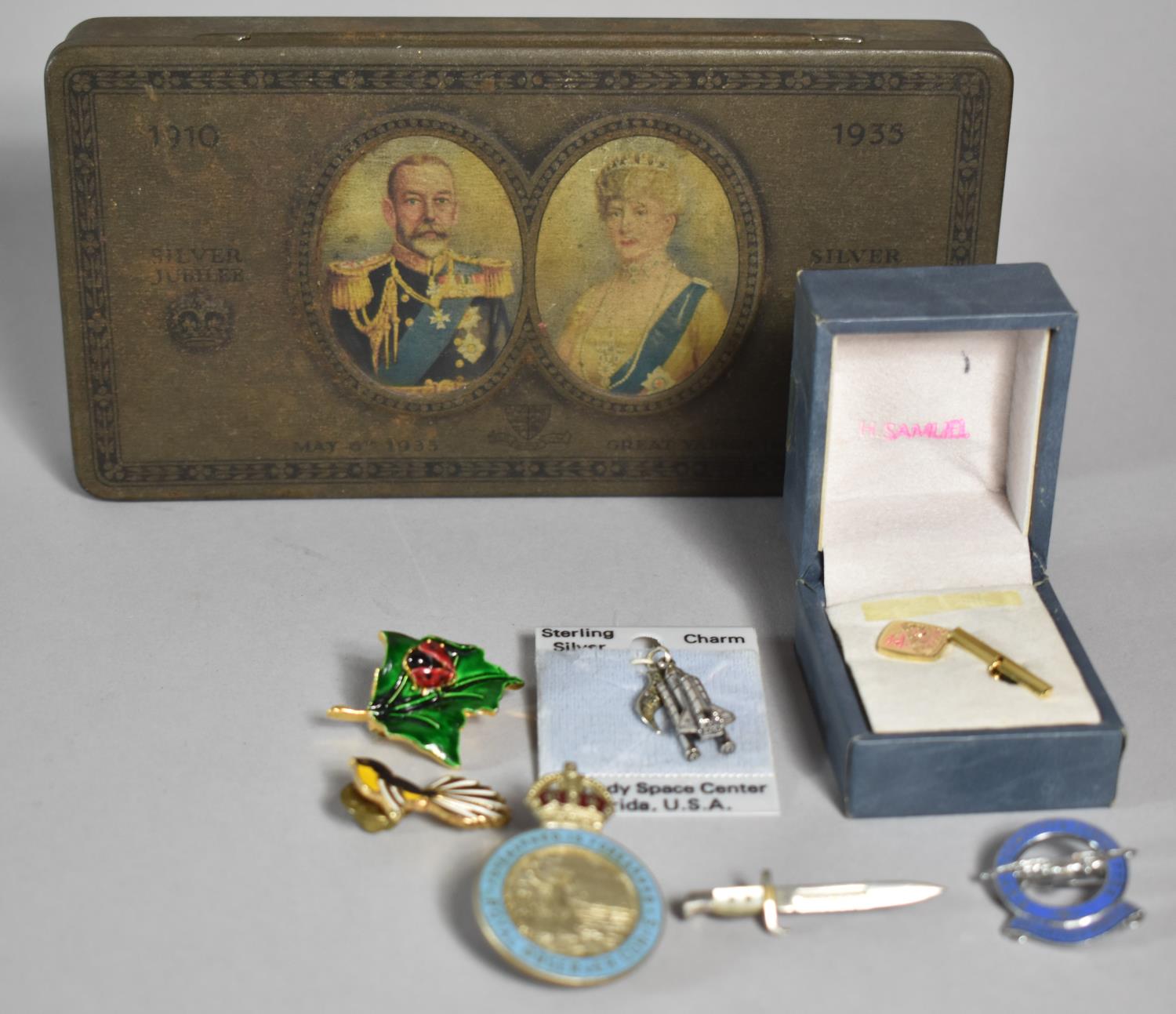 A 1935 Jubilee Tin Containing Enamelled RAF Comforts Committee Voluntary Worker Badge, Enamelled