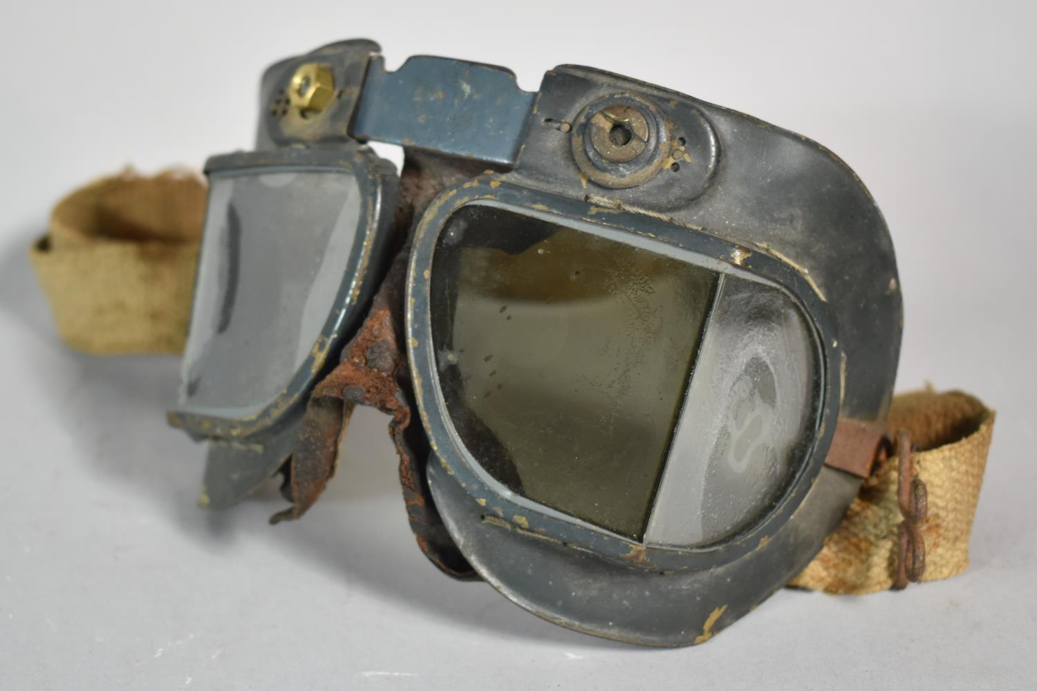 A Pair of Military Air Ministry Flying Goggles, Stamped 22C/826/2024, Angled Lenses