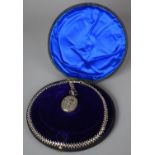 A Victorian Boxed Silver Locket and Chain, the Clasp Stamped but Illegible. Locket Embossed with