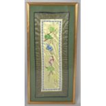 A Framed Oriental Silk Embroidered Panel Depicting Cranes and Trees, 59cm high