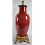 A Large Chinese Sang Boeuf Vase Set on French Ormolu Stand with Four Scrolled Feet, Vase Rim Cut