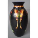 A Mid 20th Century Crown Ducal Butterfly Vase on Black Ground, 24.5cm high