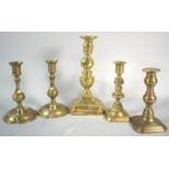 Two Pairs of Victorian Brass Candlesticks and a Single Larger Example, 25cm high