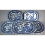 A Collection of Five Blue and White Willow Pattern Meat Plates, The Largest 44.5cm Wide