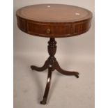 A Reproduction Three Drawer Drum Table on Tripod Support with Tooled Leather Top and Brass Claw