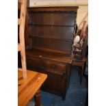 A Mid 20th Century Oak Linen Fold Dresser with Two Drawers Over Cupboard Base and Raised Two Shelf