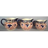 A Set of Three Imari Patterned Graduated Jugs, The Largest 14cm high