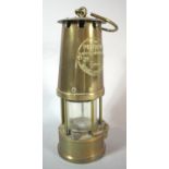 A Brass Miner's Safety Lamp by the Protector Lamp and Lighting Co Ltd