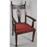 A Heavy Art Nouveau Hall Arm Chair with Hide Seat and Pierced Top Rail and Splat