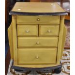 A Modern Chest of Two Short and Three Long Drawers with Side Magazine Holders on Casters, 41cm Wide