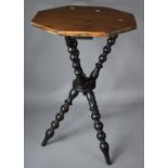 A Vintage Octagonal Topped Tripod Gypsy Table with Bobbin Supports, 49cm Diameter
