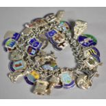 A Continental Silver Charm Bracelet with Various Silver and White Metal Enamelled Souvenir Charms