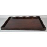 An Oriental Hardwood Rectangular Tray with Pierced Gallery, 61cm Long