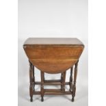 A Small Oak Drop Leaf Gate Leg Occasional Table with Oval Top, 62cm long