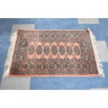 A Small Patterned Woollen Hearth Rug, 97cm x 65cm