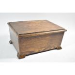 An Edwardian Oak Lift Top Sewing Box with Embroidered Interior, 32cm wide