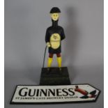 A Reproduction Cast Metal Figural Advertising Money Box for Guinness, 36cm high, Together with a