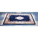 A Chinese Woollen Rug on Blue Ground, 1.52 x 0.91m