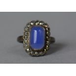 A Pretty Silver and Cut Blue Glass Ring with Marcasite Mounts