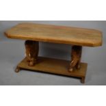 A Rectangular Coffee Table with Carved Elephant Supports, 90cm wide
